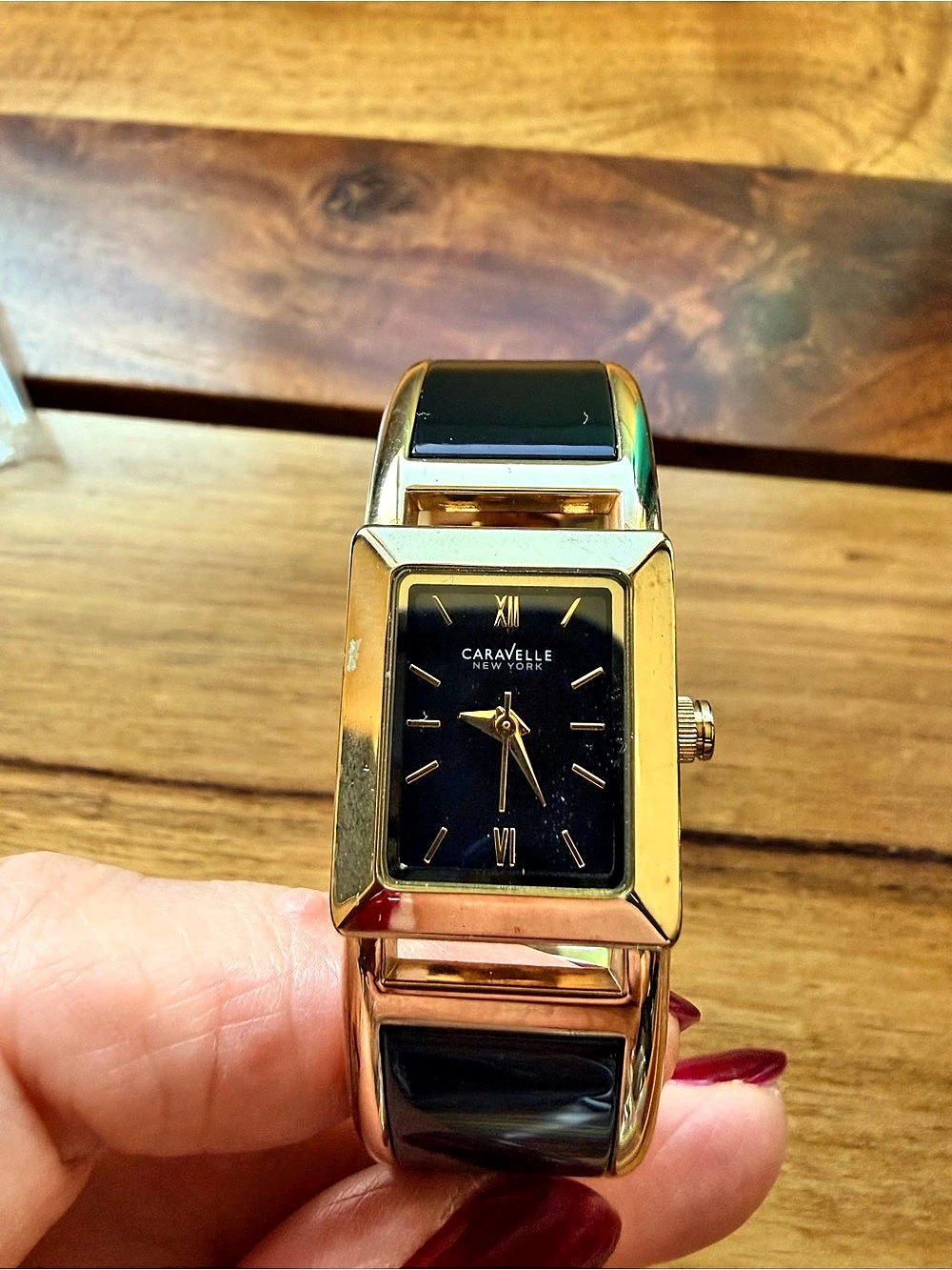 Caravelle New York Women's Gold Tone / Black Bangle Roman Analog Watch 44L147